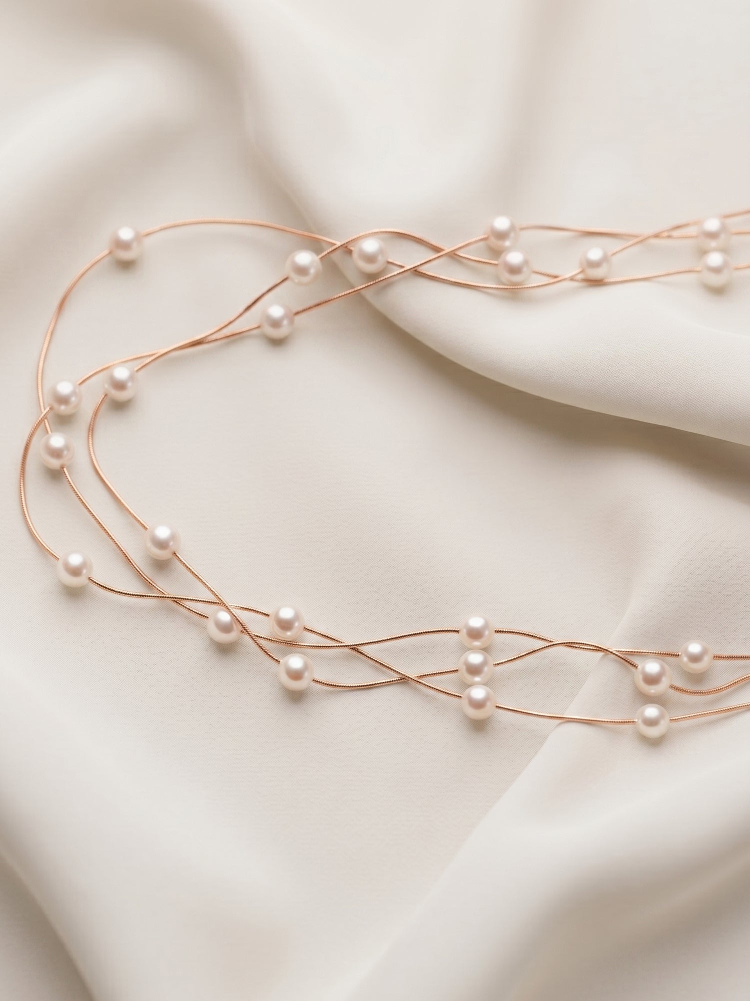 Triple Strand Floating Pearl Station Necklace in Rose Gold