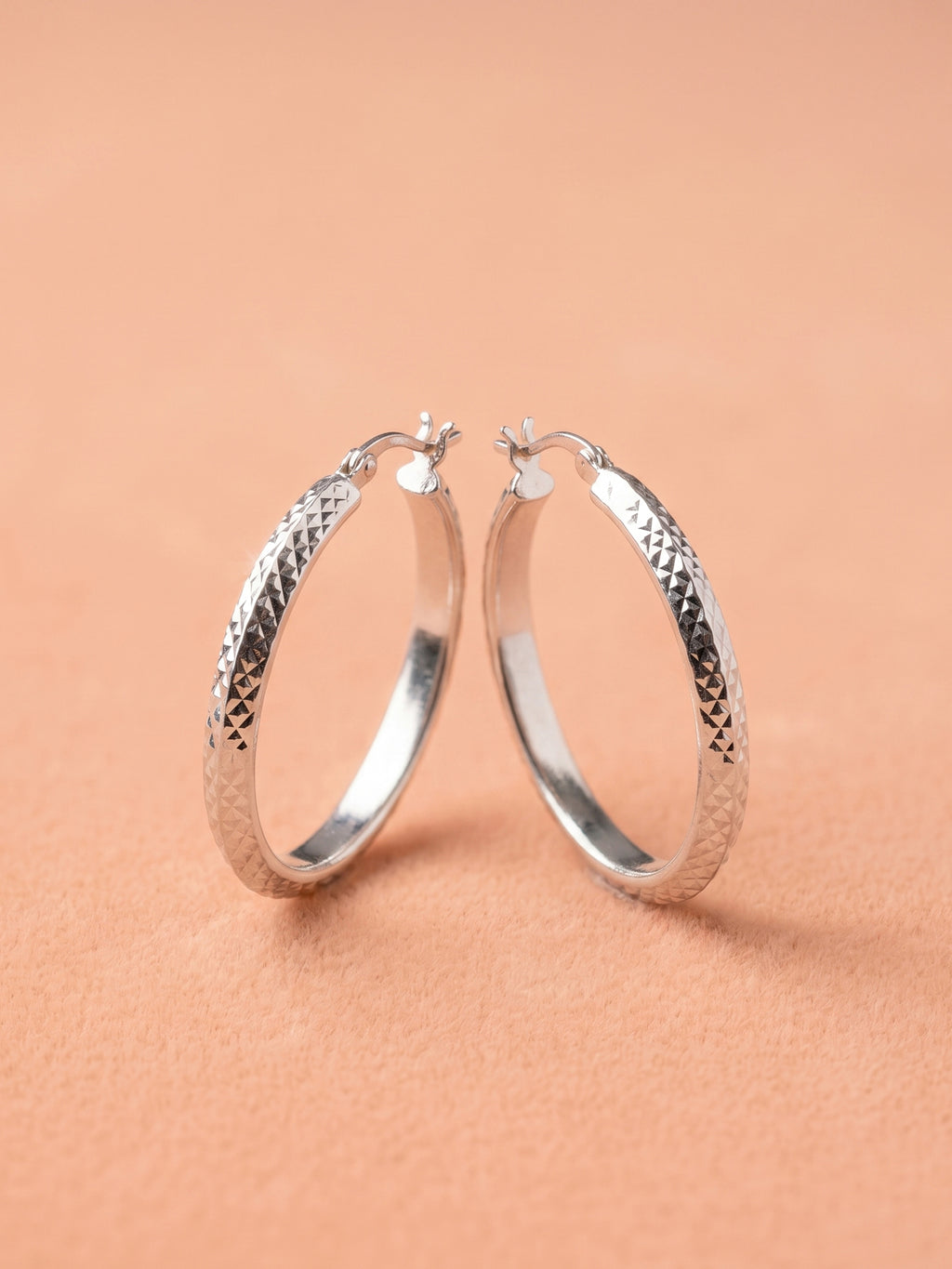 Faceted Diamond-Cut Oval Hoop Earrings
