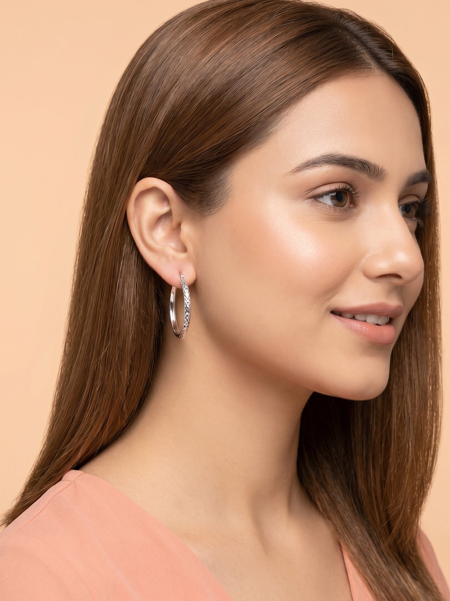 Faceted Diamond-Cut Oval Hoop Earrings
