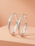 Faceted Diamond-Cut Oval Hoop Earrings
