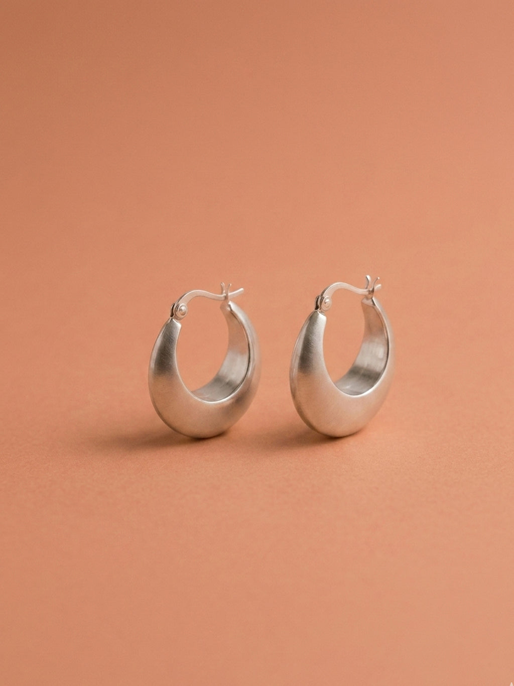 Sleek Silver Crescent Hoops