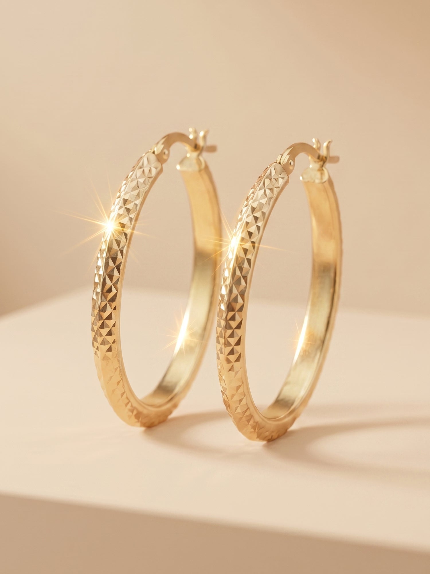 Diamond-Cut Oval Hoop Earrings