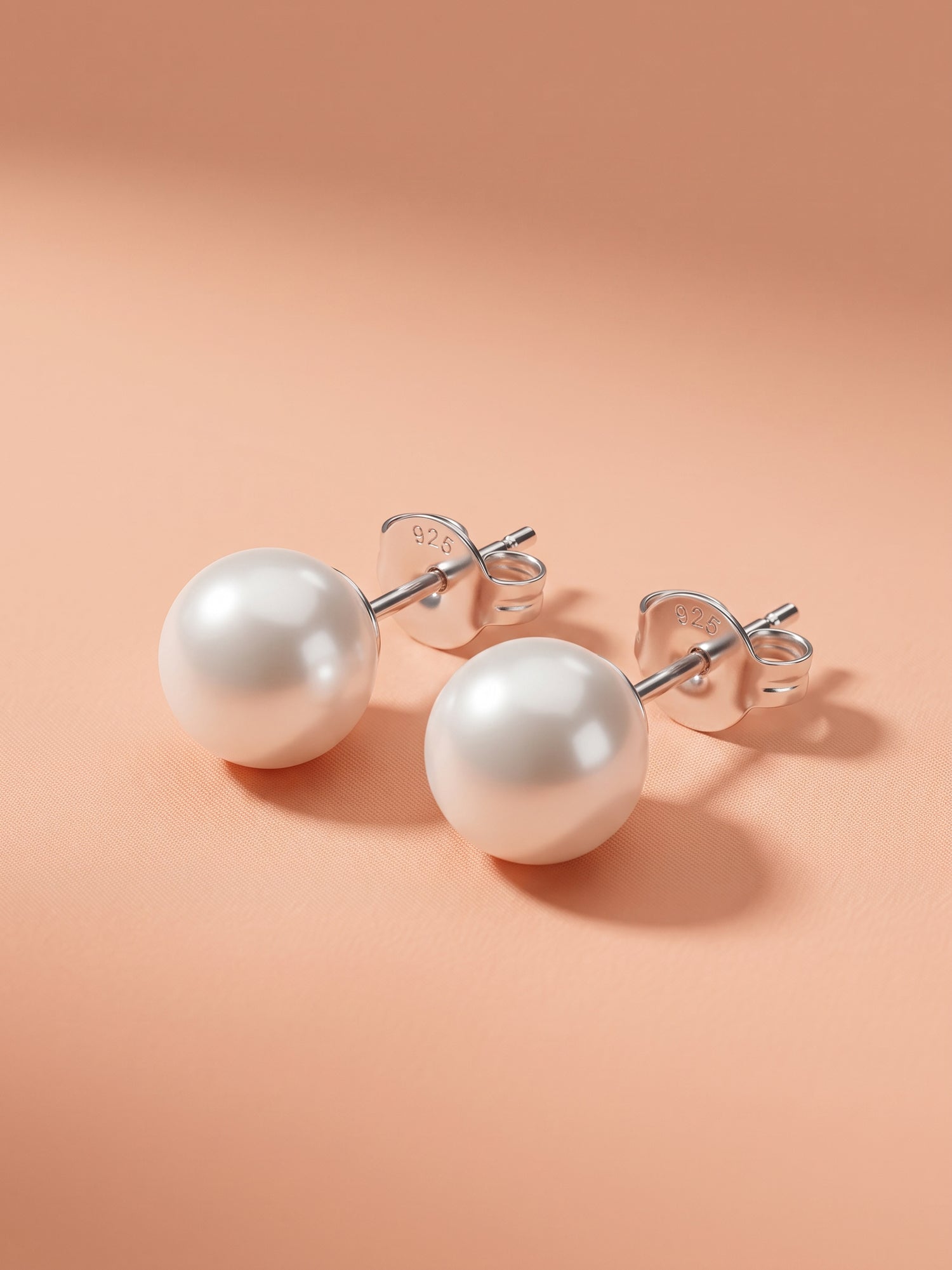 The Celestial Grace: Classic Sterling Silver Pearl Stud Earrings