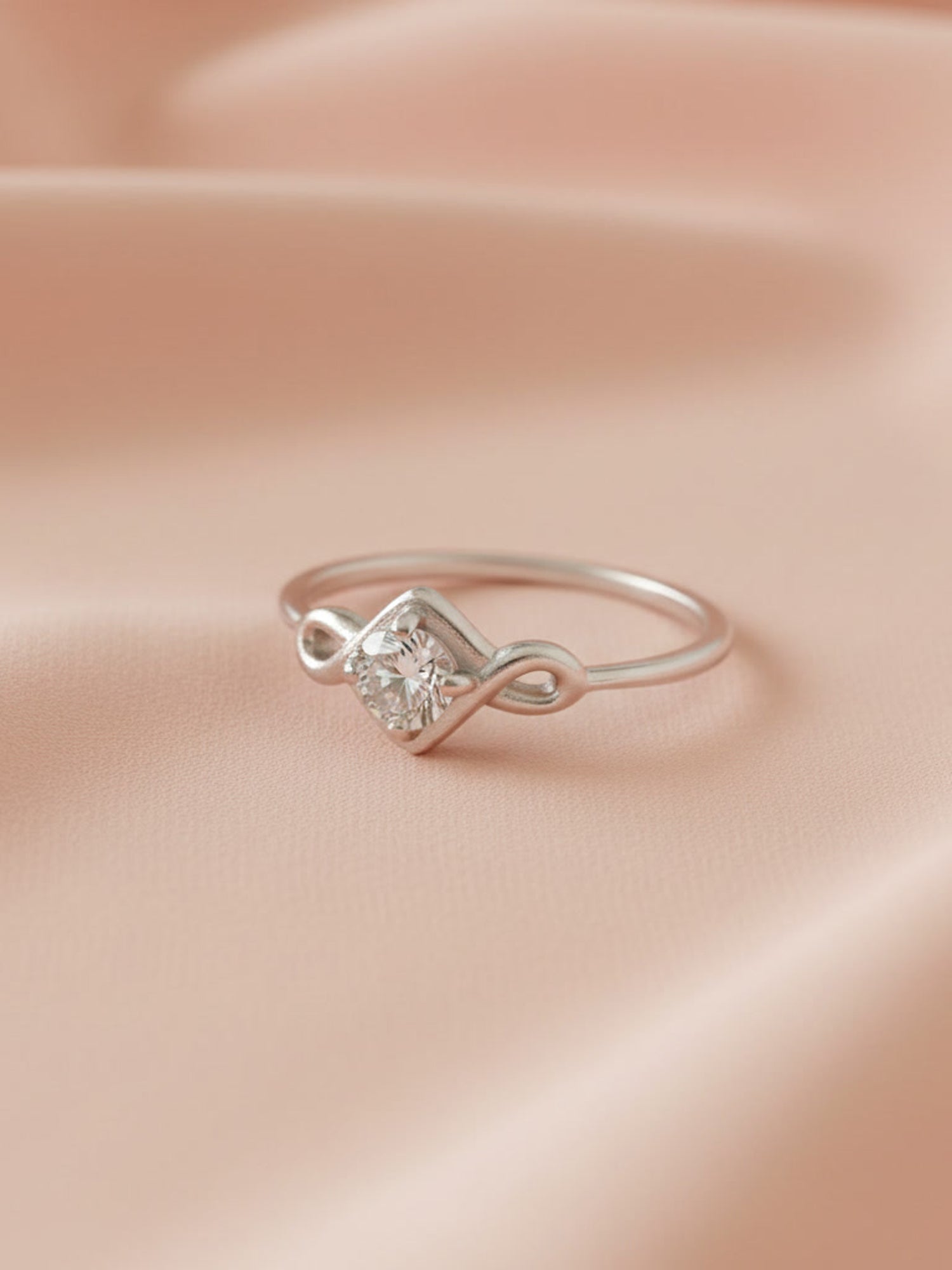 Infinity Swirl Solitaire Ring