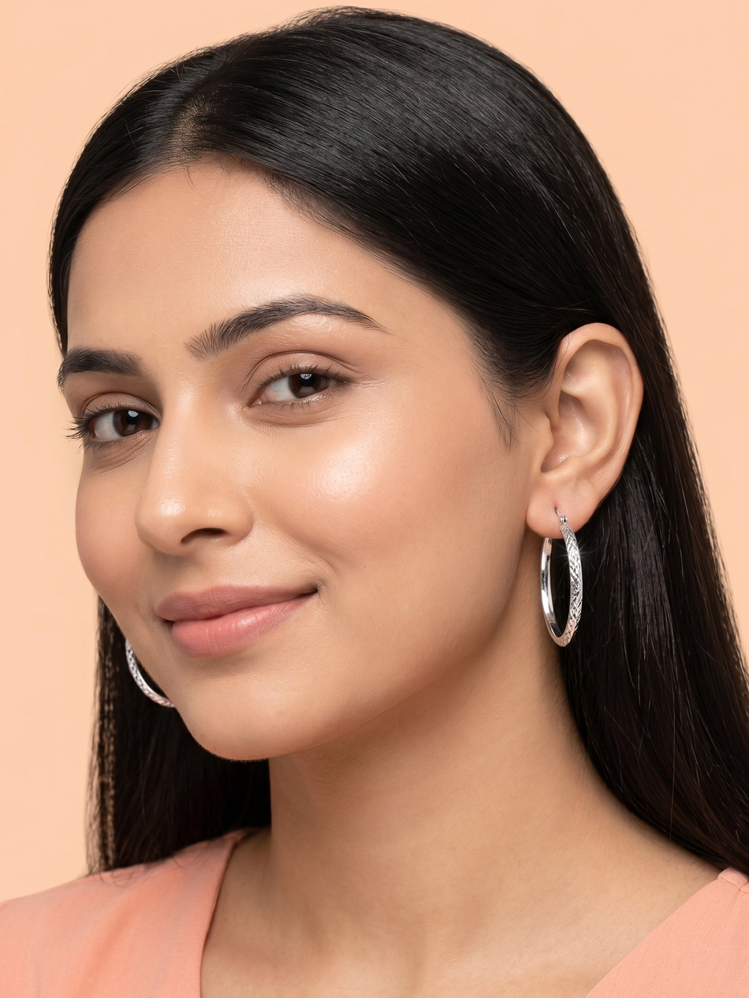 Faceted Diamond-Cut Oval Hoop Earrings