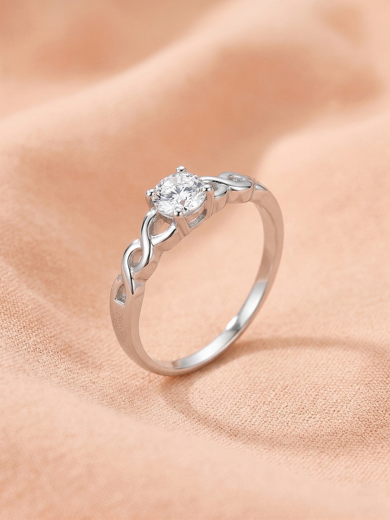 Silver Braided Infinity Solitaire Ring