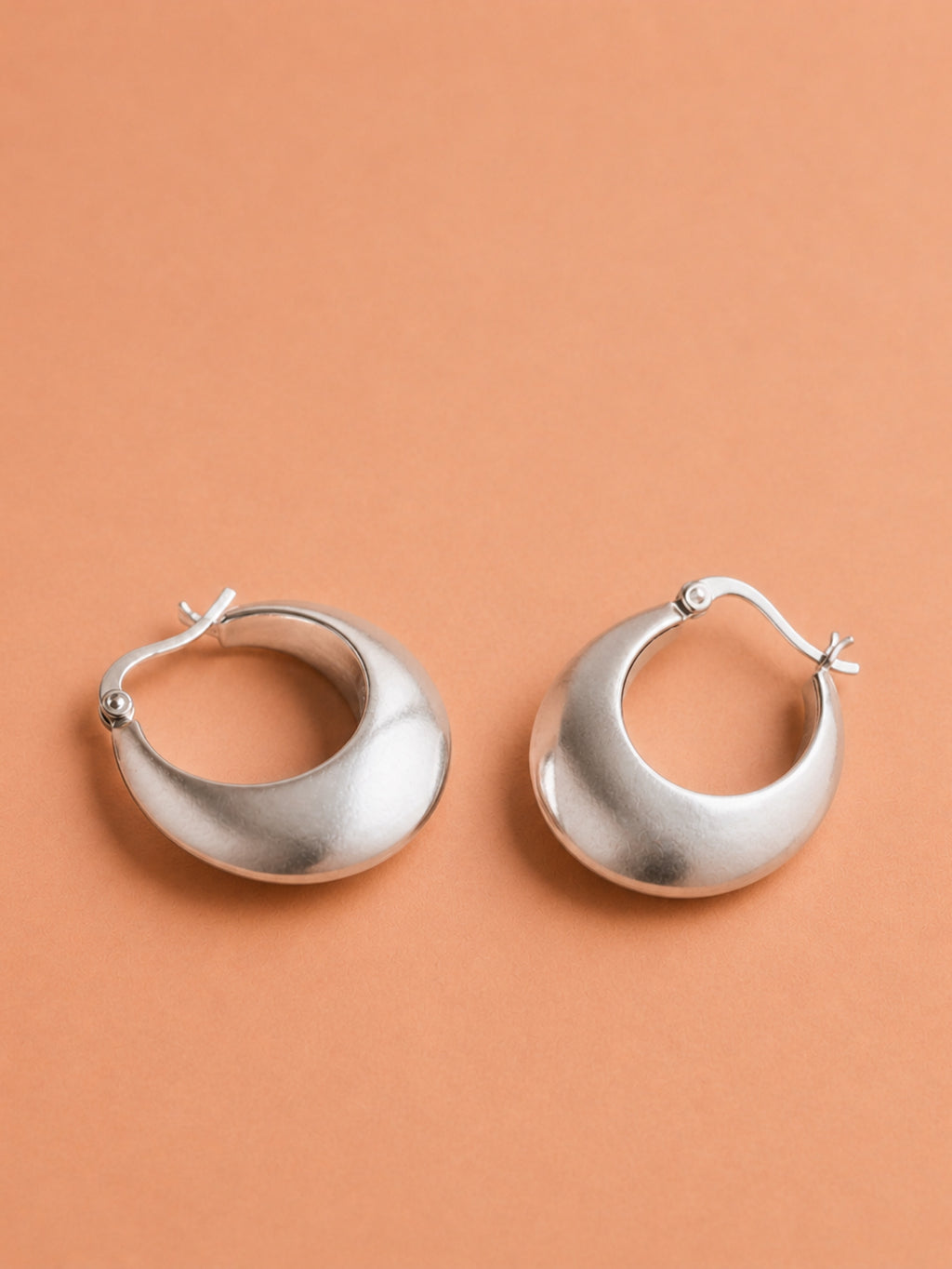 Sleek Silver Crescent Hoops