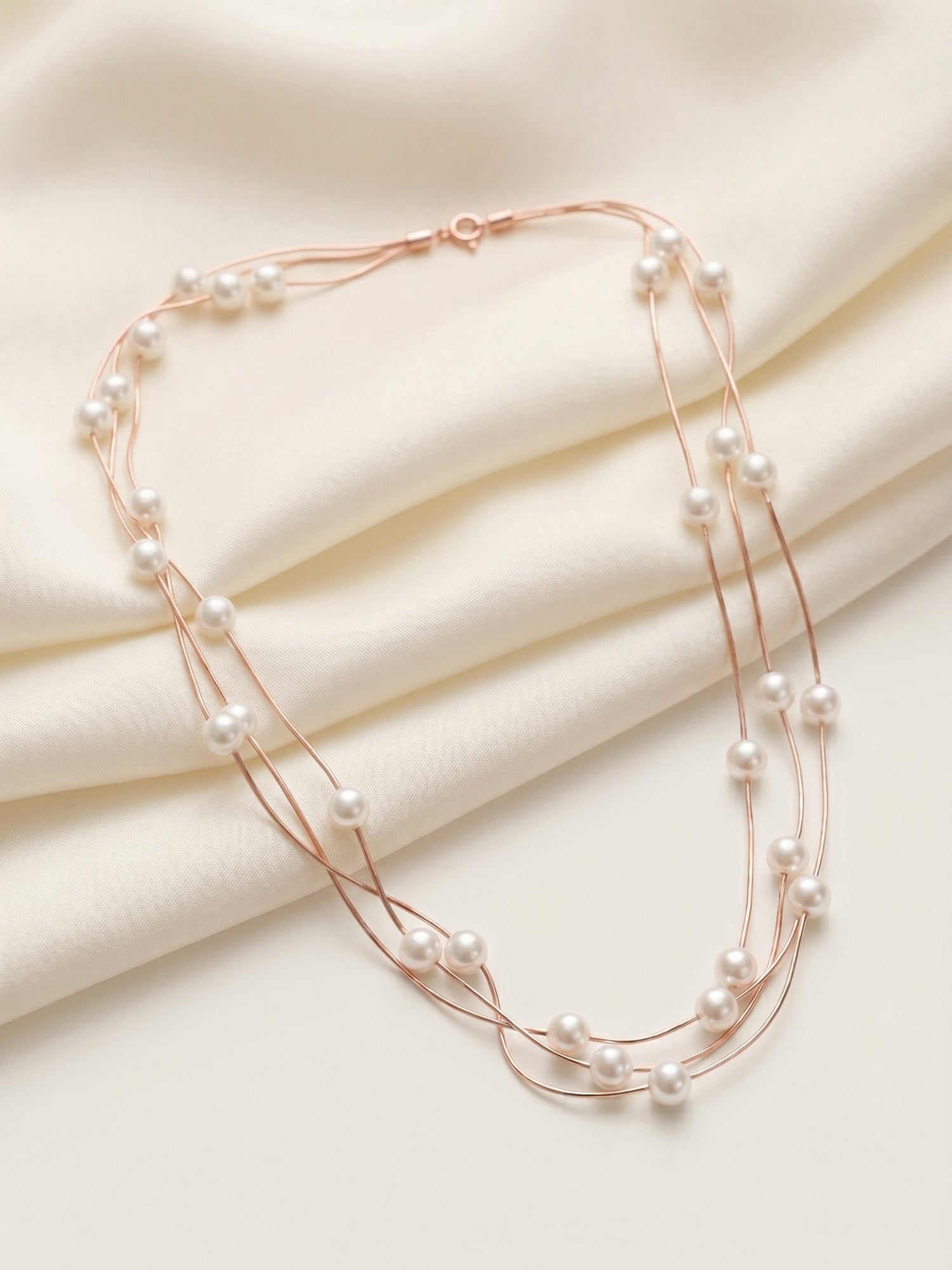 Triple Strand Floating Pearl Station Necklace in Rose Gold