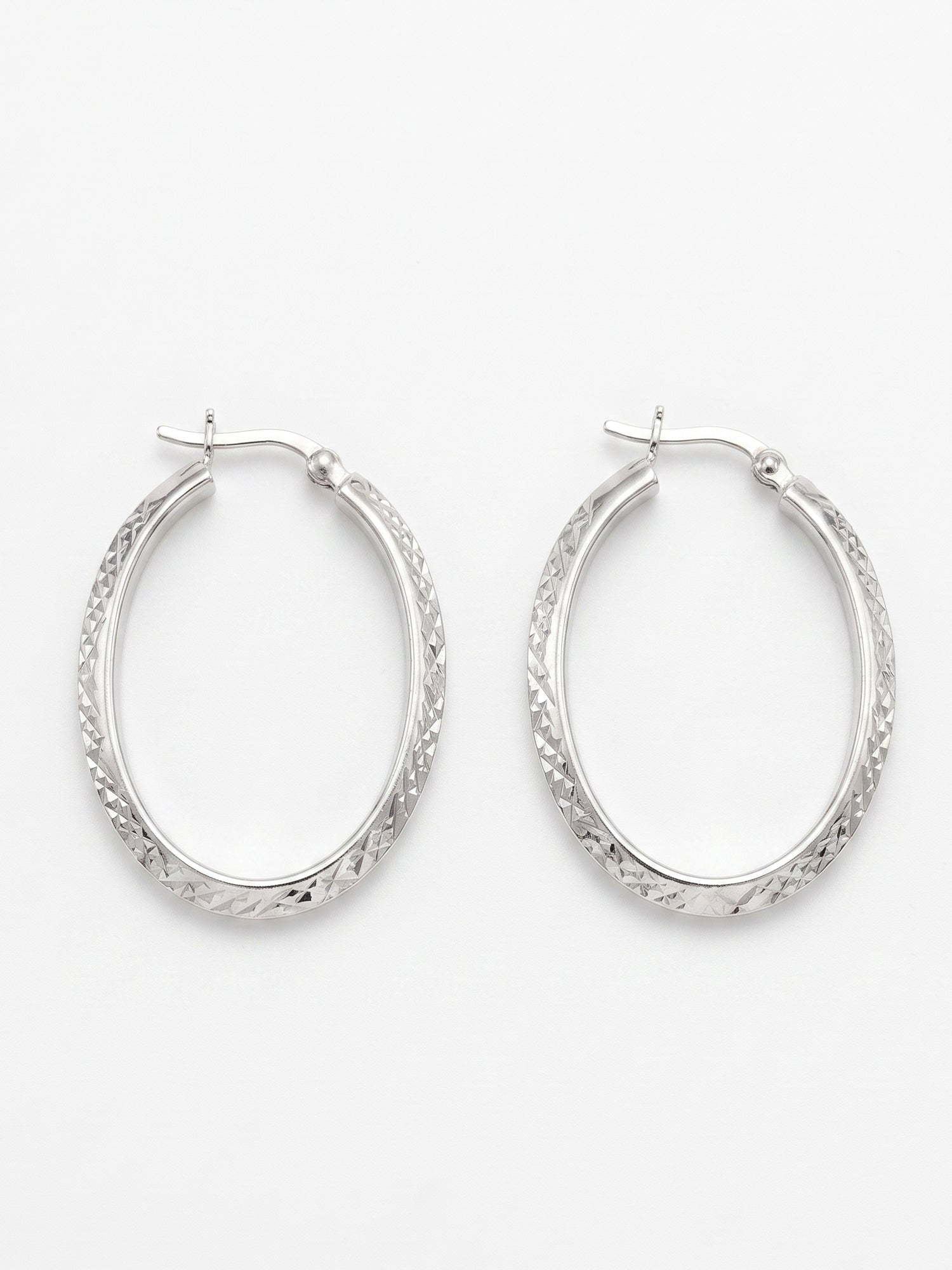 Faceted Diamond-Cut Oval Hoop Earrings
