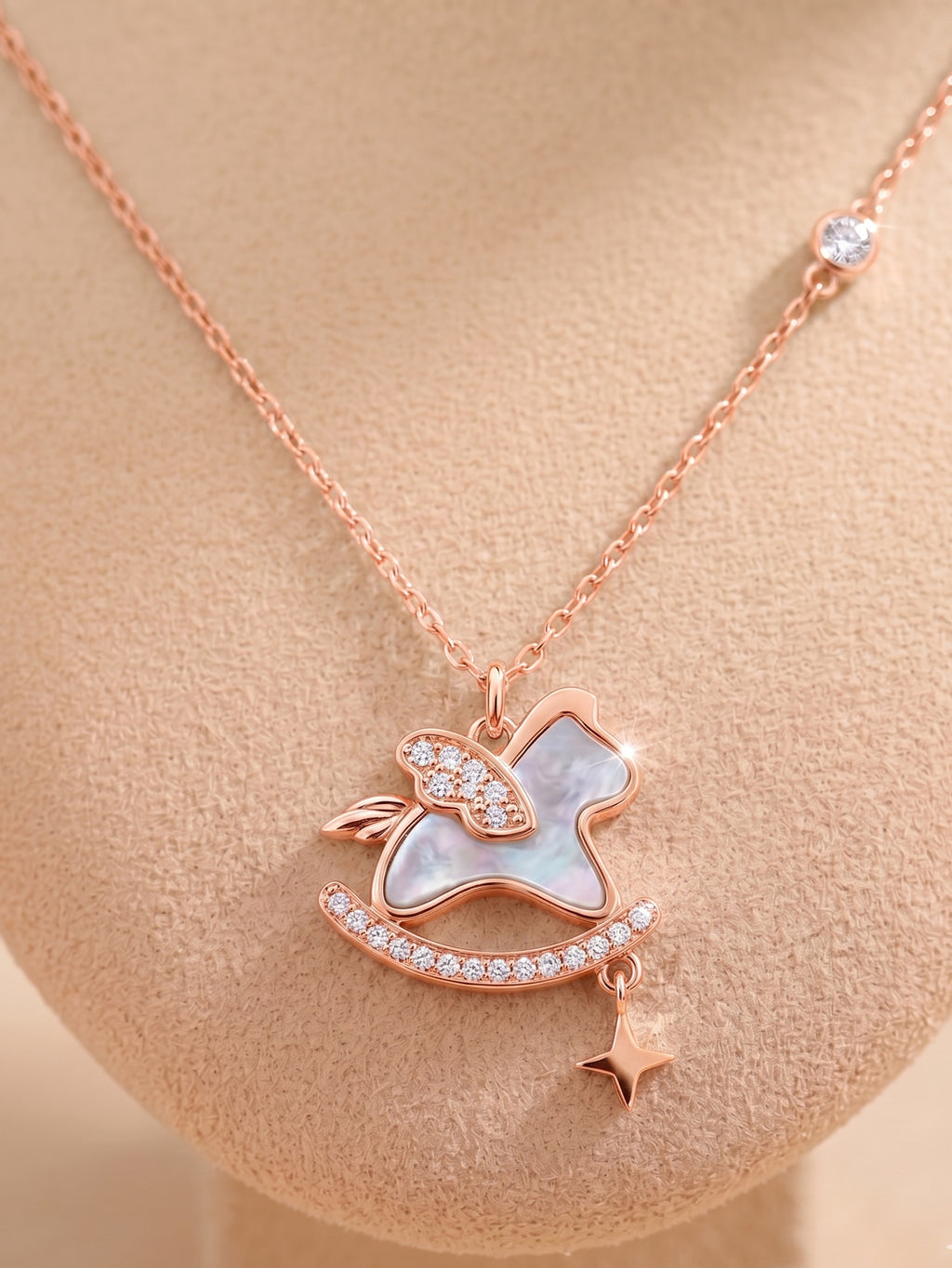 Roseate Shimmering Rocking Horse Pendant Necklace