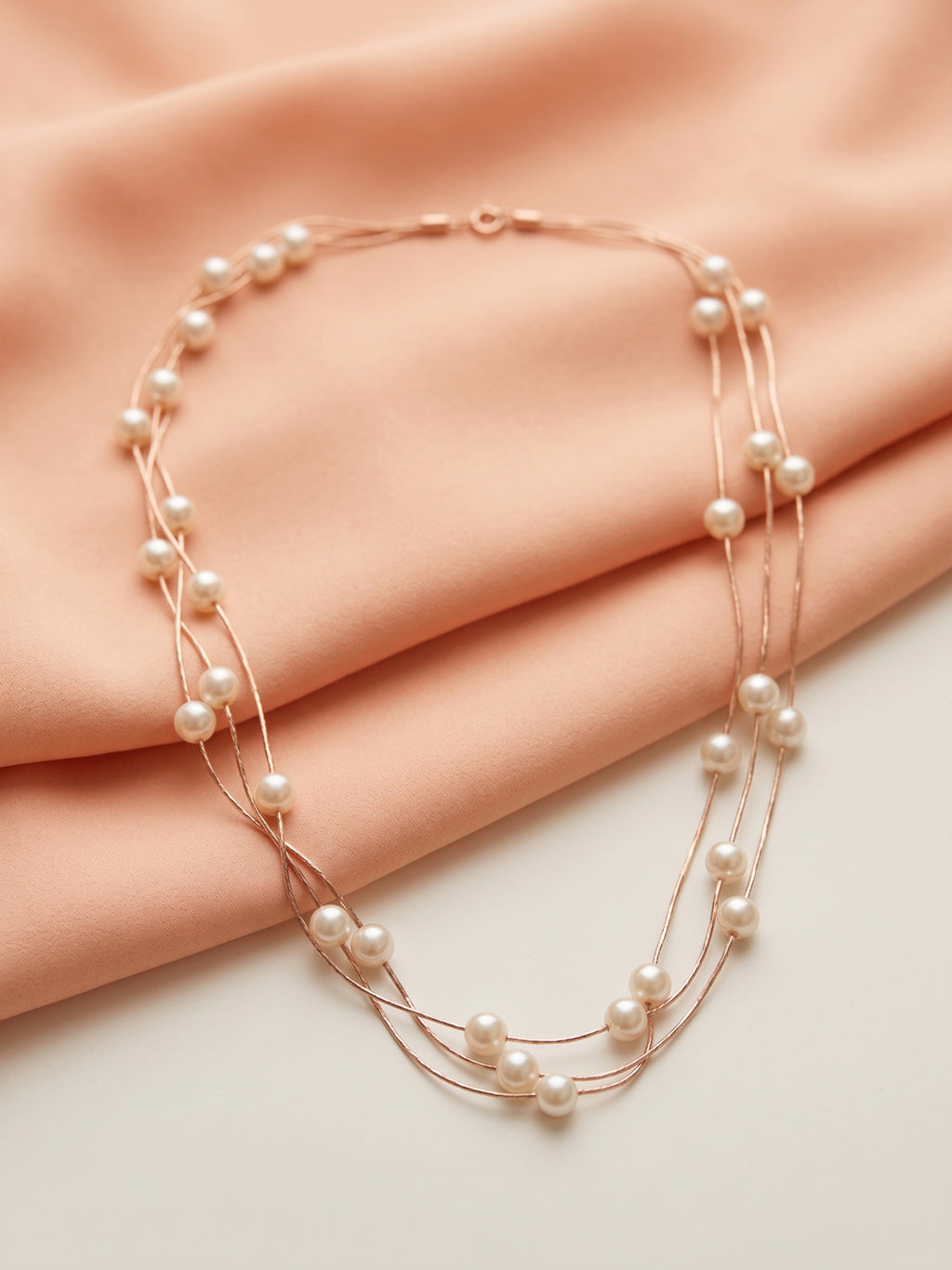 Triple Strand Floating Pearl Station Necklace in Rose Gold