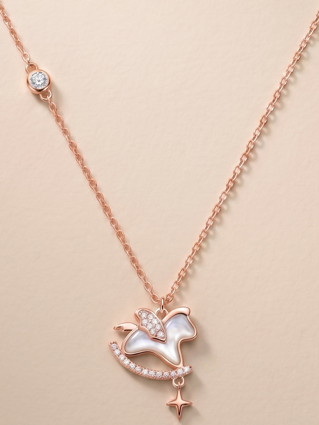 Roseate Shimmering Rocking Horse Pendant Necklace