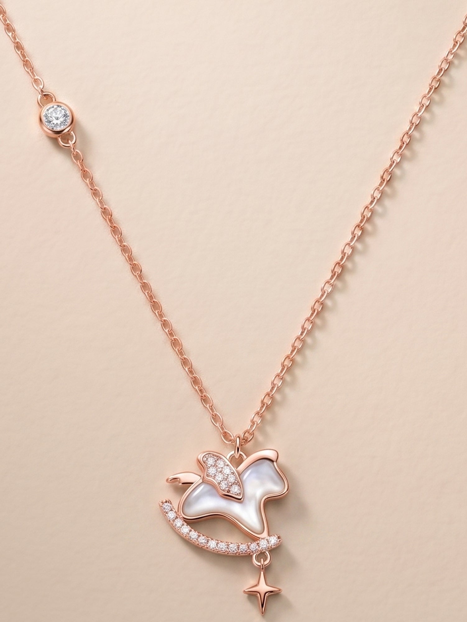 Roseate Shimmering Rocking Horse Pendant Necklace