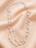 Triple Strand Floating Pearl Station Necklace